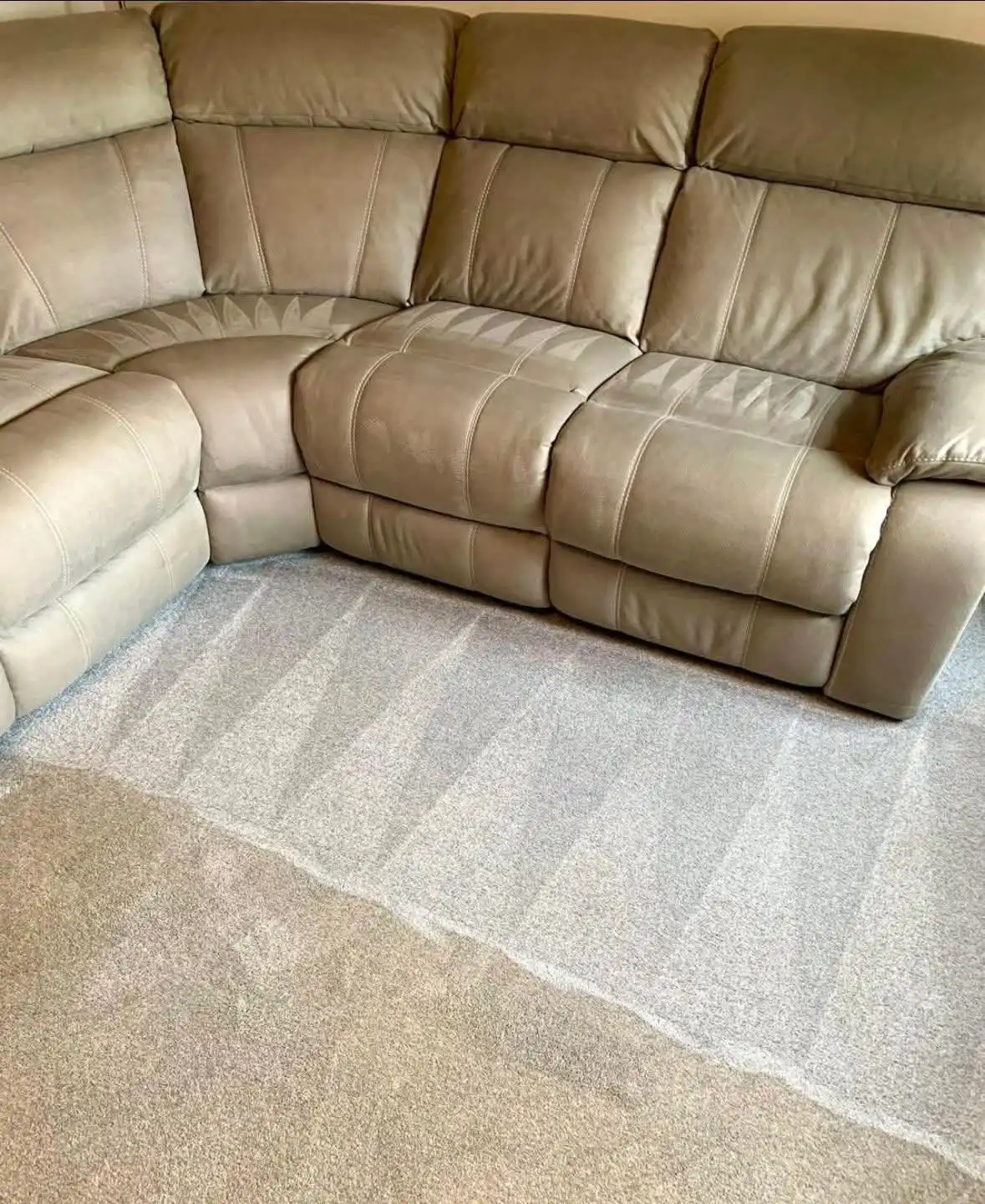 Sofa upholstery being steam cleaned