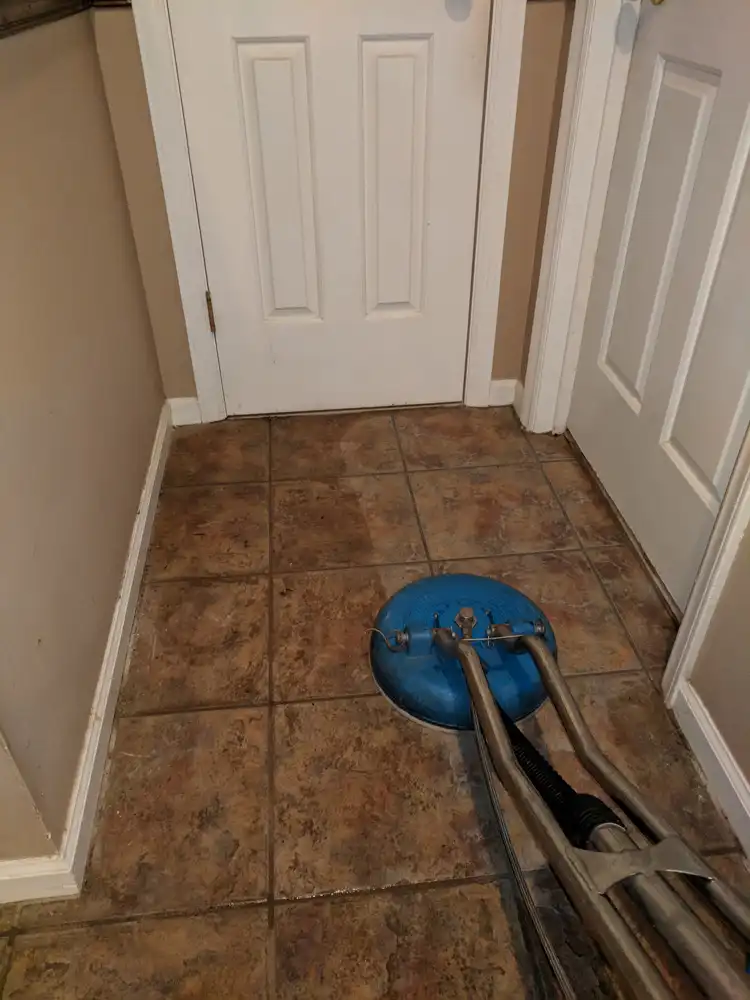 Tile floor and grout lines being deep cleaned